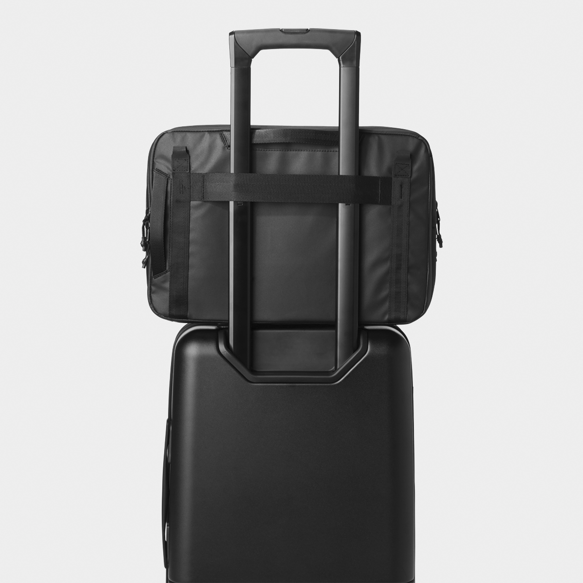 Black Tech Case Attached to a Carry-On Back View